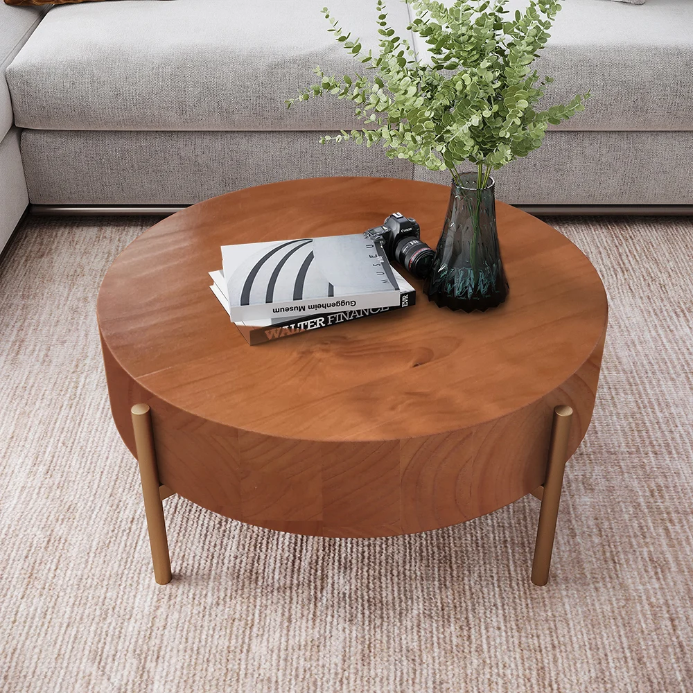 Rustic round coffee table with natural pine wood top and gold metal legs, minimalist design