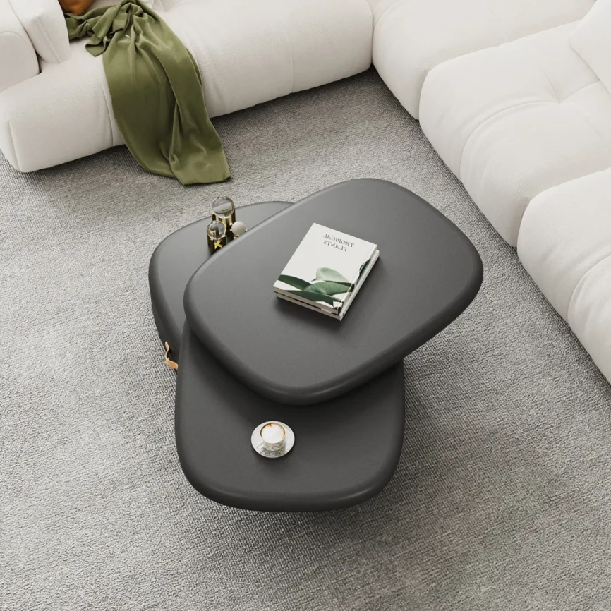 luna rotating oval coffee table with pebble design and black finish