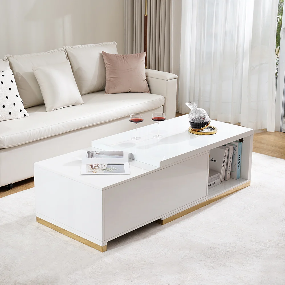 Modern extendable glossy white coffee table with stainless steel base, two drawers, and open storage.