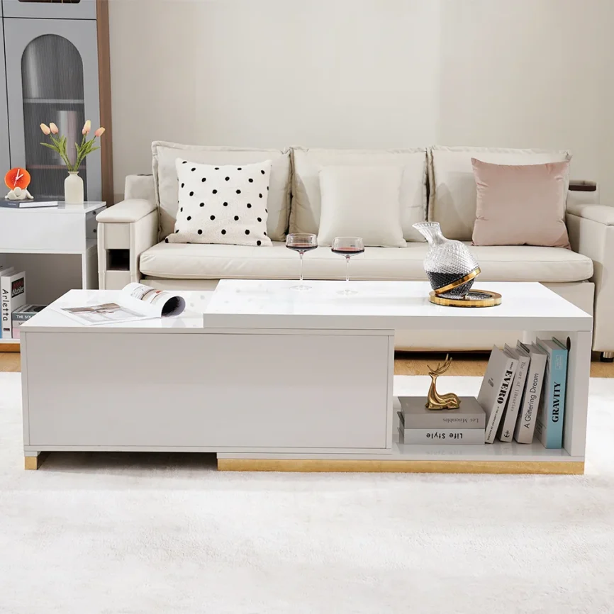 Modern extendable glossy white coffee table with stainless steel base, two drawers, and open storage.