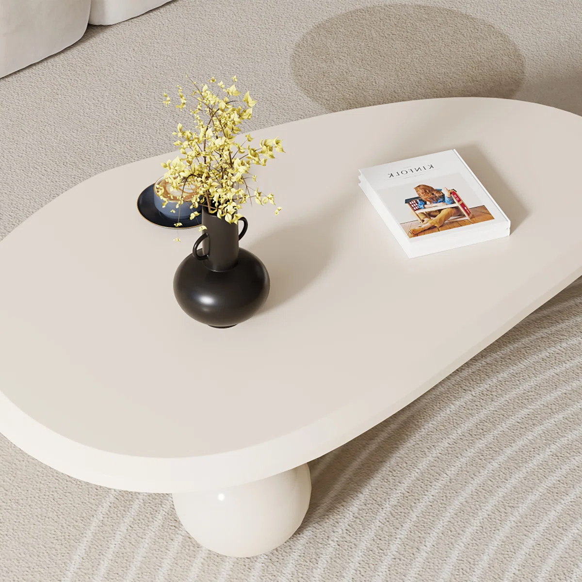 oval cream black brown modern coffee table with three round legs