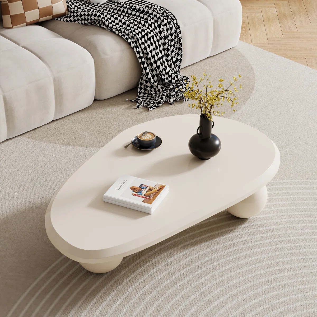 oval cream black brown modern coffee table with three round legs