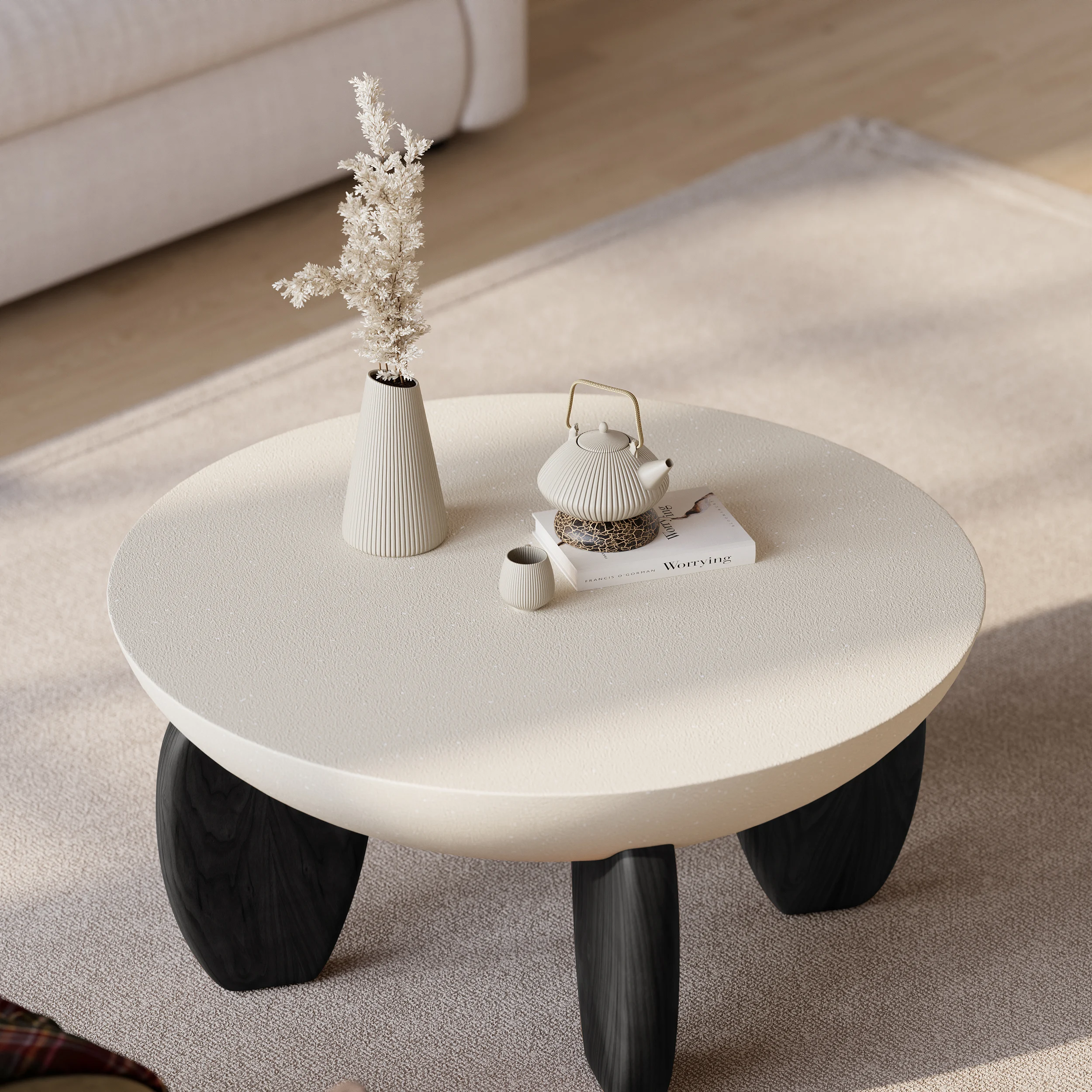 terra round concrete coffee table with ash wood legs and desert sand finish