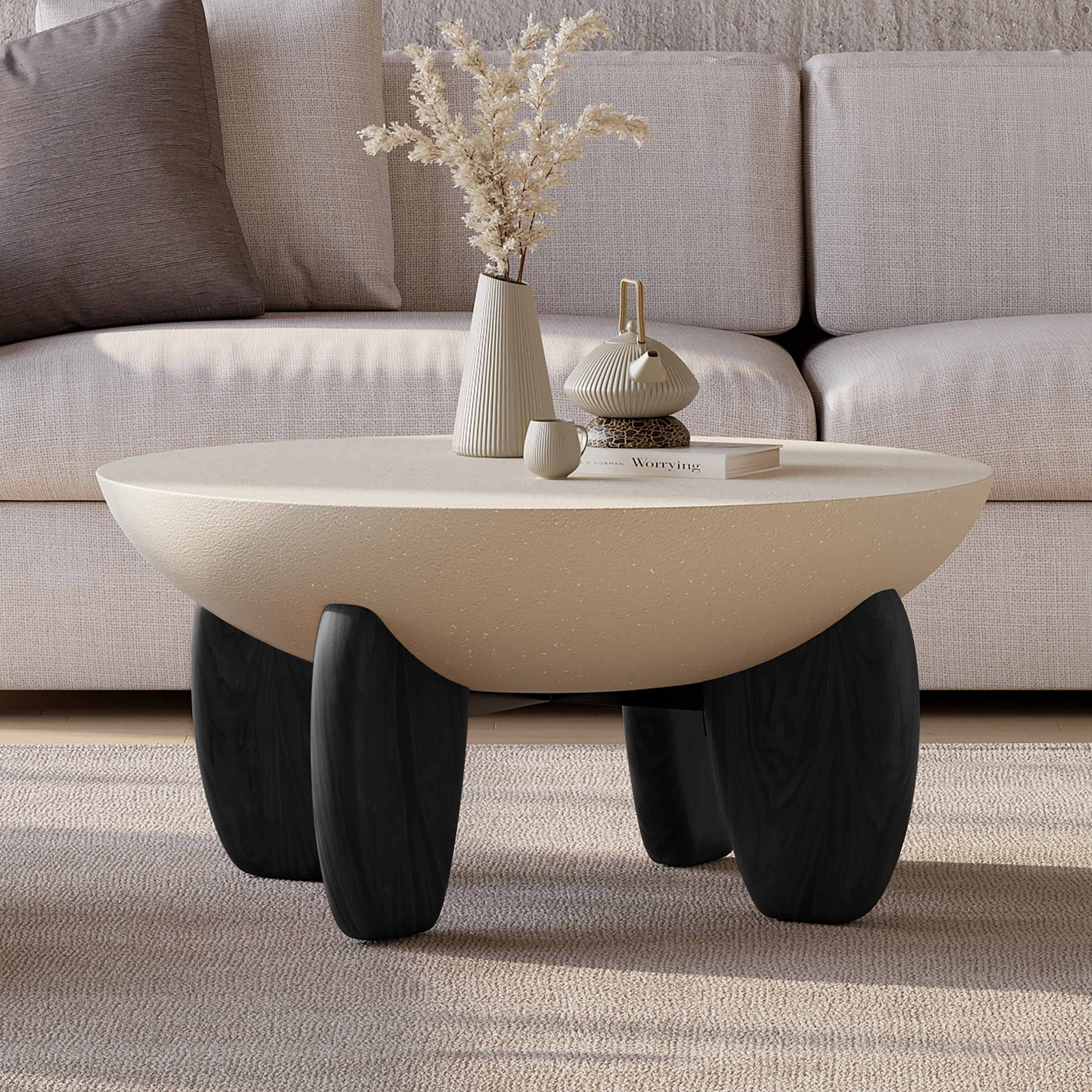 terra round concrete coffee table with ash wood legs and desert sand finish