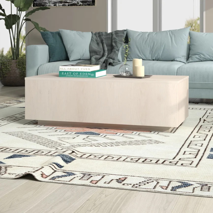 Arden Low-Profile Coffee Table in wood-grain finish, rectangular design with solid apron base, 38 cm tall, styled in a modern living room.