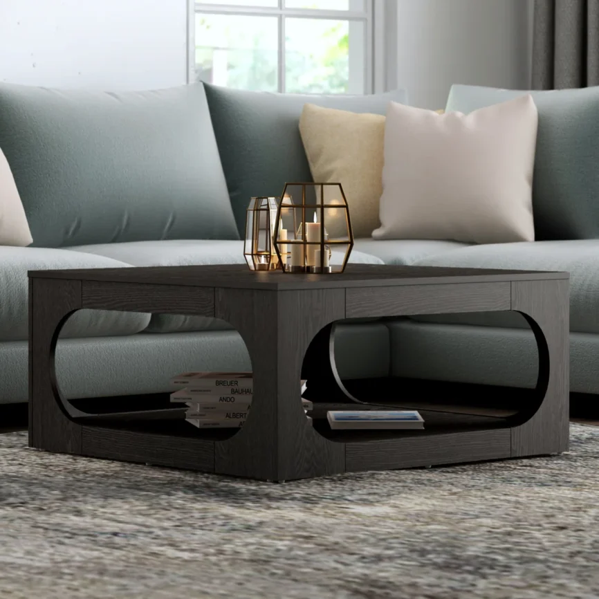 Square coffee table with oval cutout sides, spacious tabletop, and lower storage shelf, finished in modern gray with block feet.