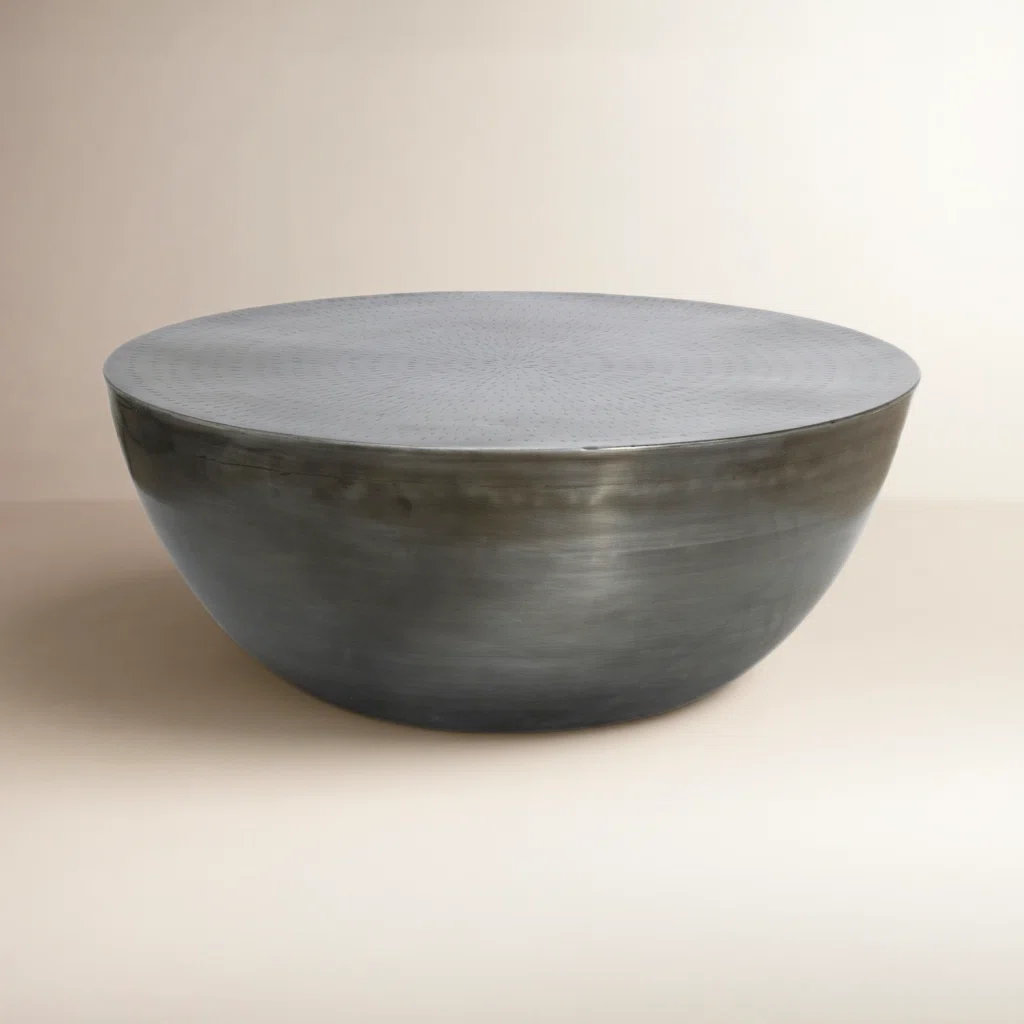 Aurelia Drum Coffee Table in solid iron with round silhouette and indented tabletop, modern minimalist design for living room