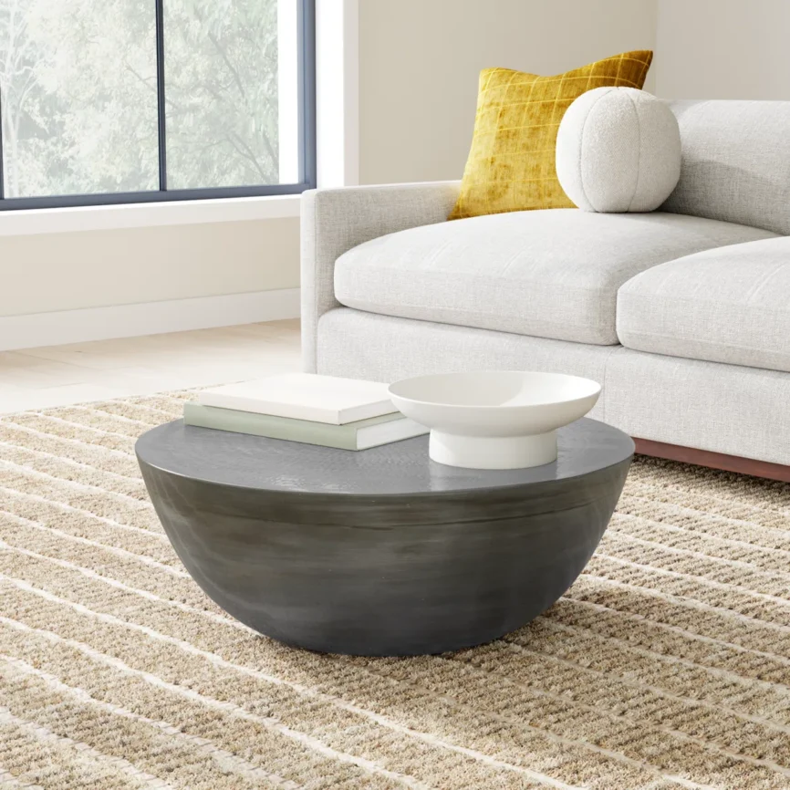 Aurelia Drum Coffee Table in solid iron with round silhouette and indented tabletop, modern minimalist design for living room