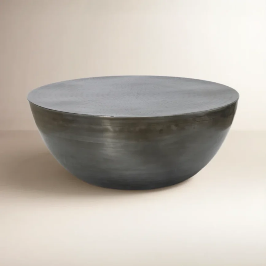 Aurelia Drum Coffee Table in solid iron with round silhouette and indented tabletop, modern minimalist design for living room