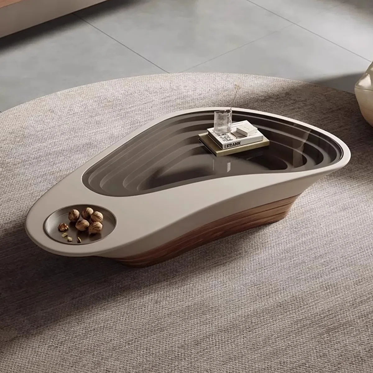 Aurelia Glass-Top Coffee Table with walnut veneer, tempered glass top, and rounded arc corners in a modern living room.