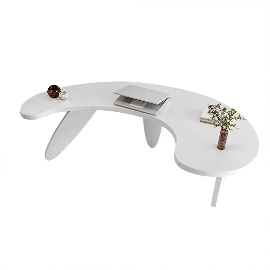 Modern curved white executive writing desk with three oval legs, engineered wood construction, and angled edges in a contemporary white finish.