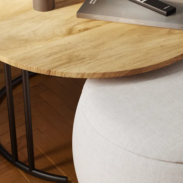 walnut‑effect coffee table with upholstered pouffe stored underneath