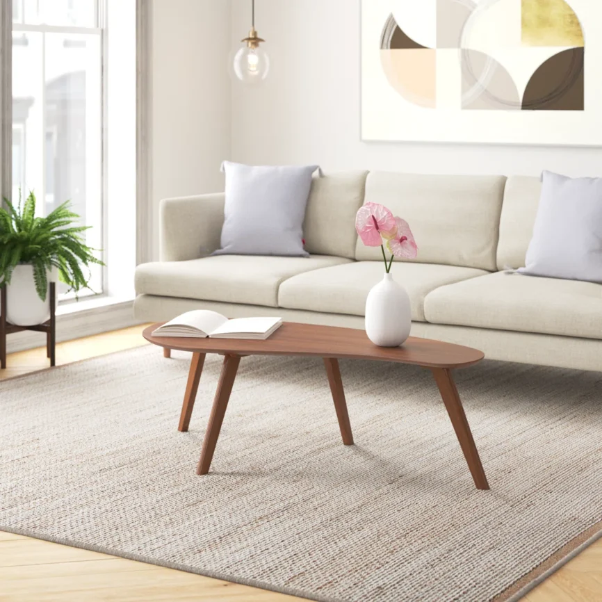 Campanelli Flow Coffee Table with free-form engineered wood top and flared solid wood legs in a modern living room