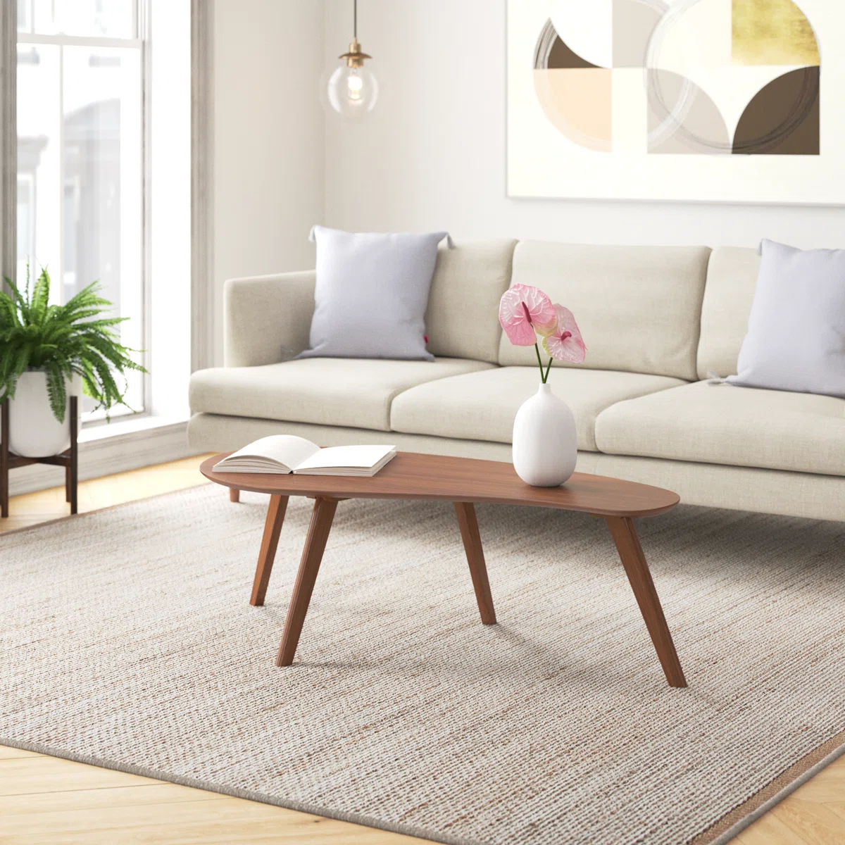 Campanelli Flow Coffee Table with free-form engineered wood top and flared solid wood legs in a modern living room