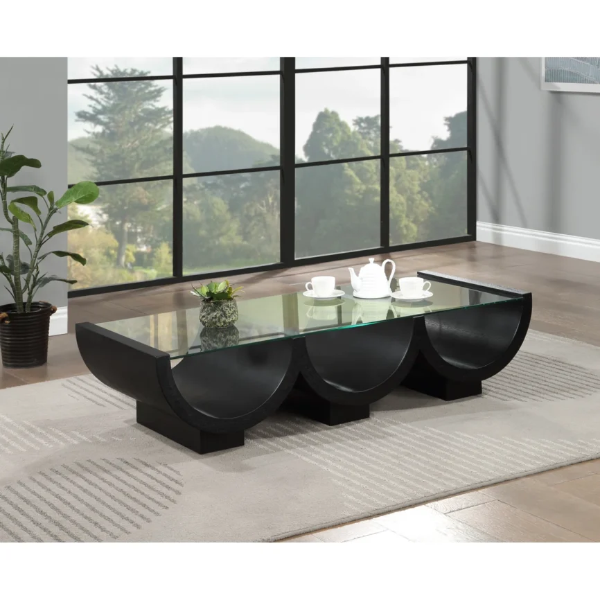 Art Deco-inspired coffee table with clear tempered glass top and geometric black pedestal base