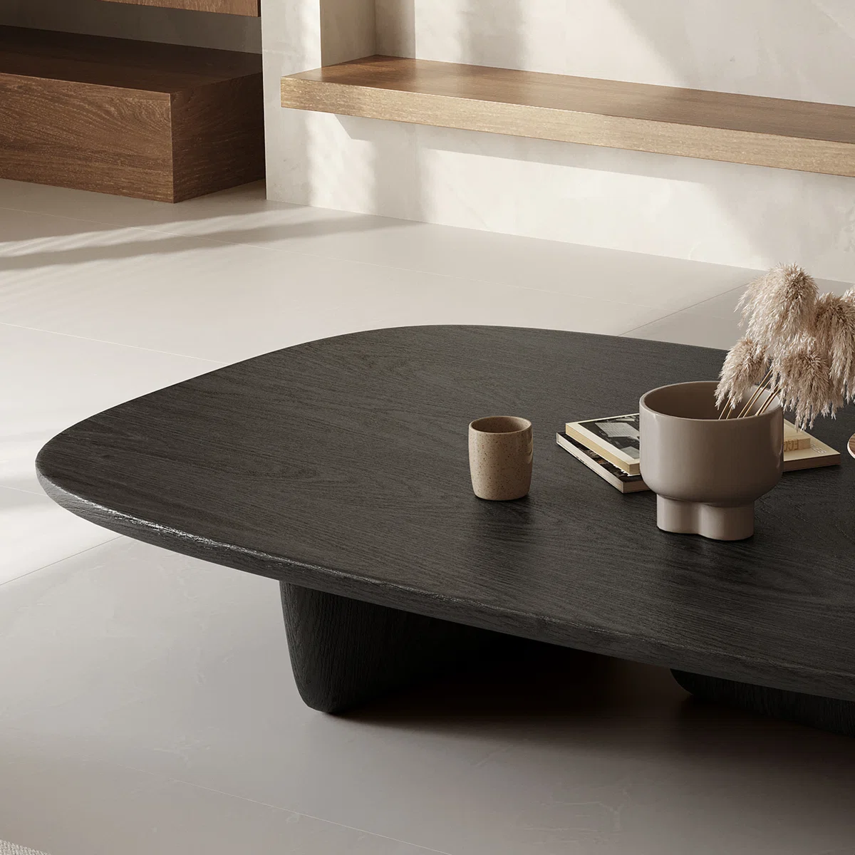oval matte black coffee table with pedestal base