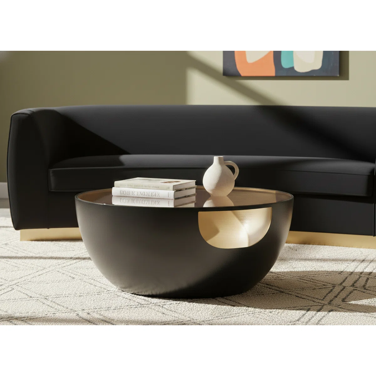 round glass coffee table with matte black base and brushed gold interior