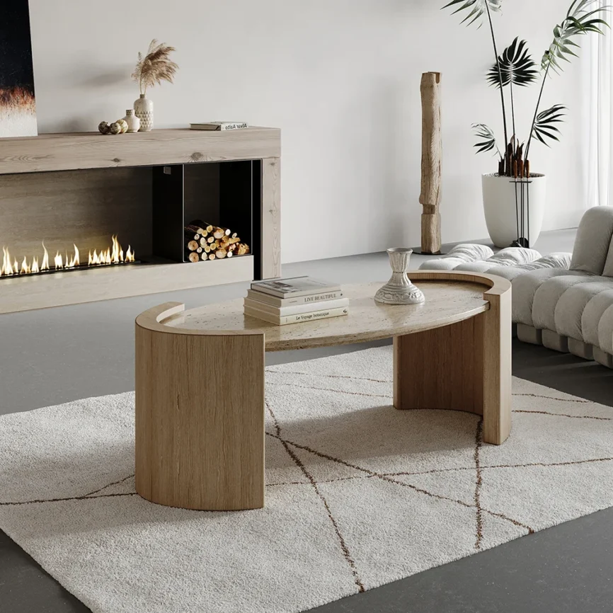Japandi oval coffee table with beige travertine stone top and natural wooden double pedestal base