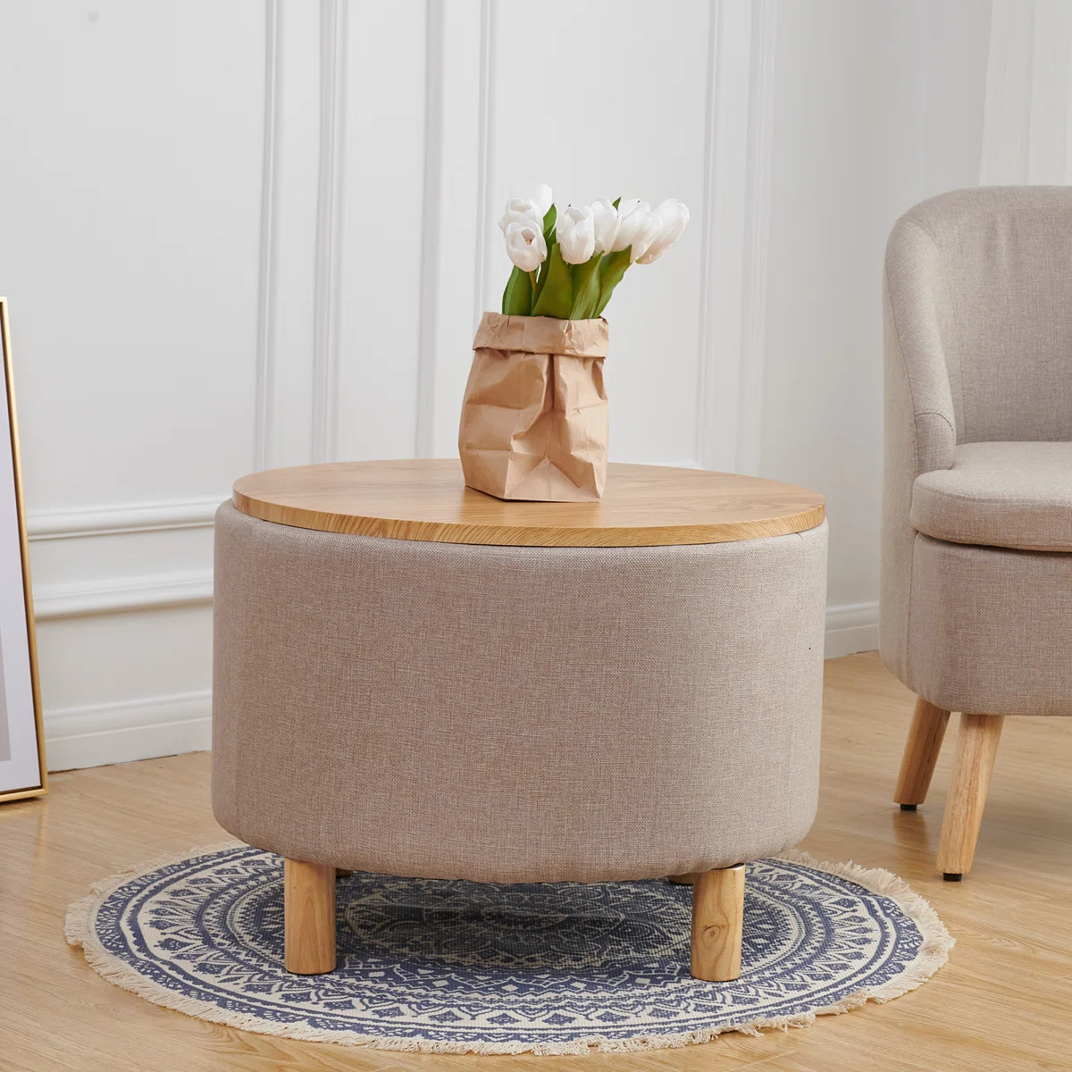 Round solid wood coffee table with three-leg base, hidden storage cabinet, and removable tray