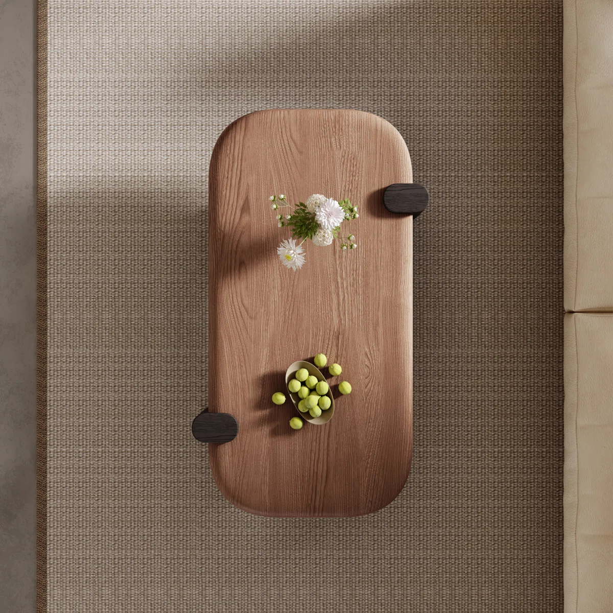 Rectangular walnut coffee table with rounded corners, natural wood grain top, and black sled base, styled as a farmhouse‑inspired living room centerpiece.