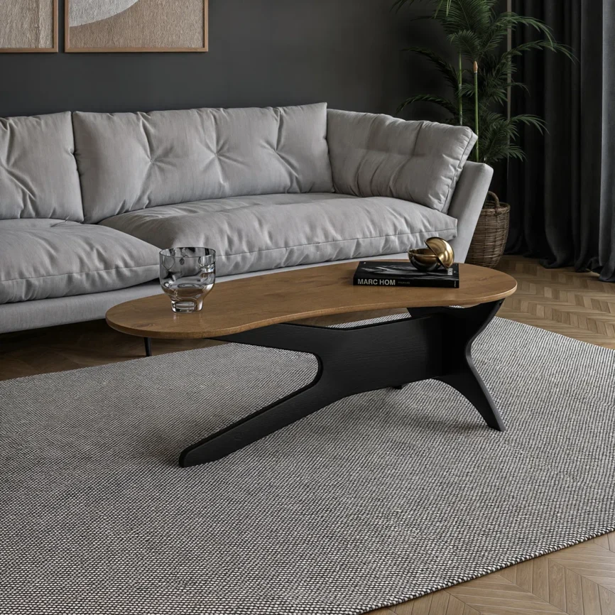 Abstract freeform solid wood coffee table with sculptural base, natural pine grain, and mid‑century modern design, styled as a living room centerpiece.