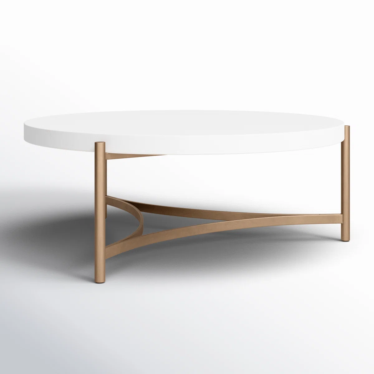 Round white concrete coffee table with brushed bronze stainless steel base, tubular legs, and curved stretchers.