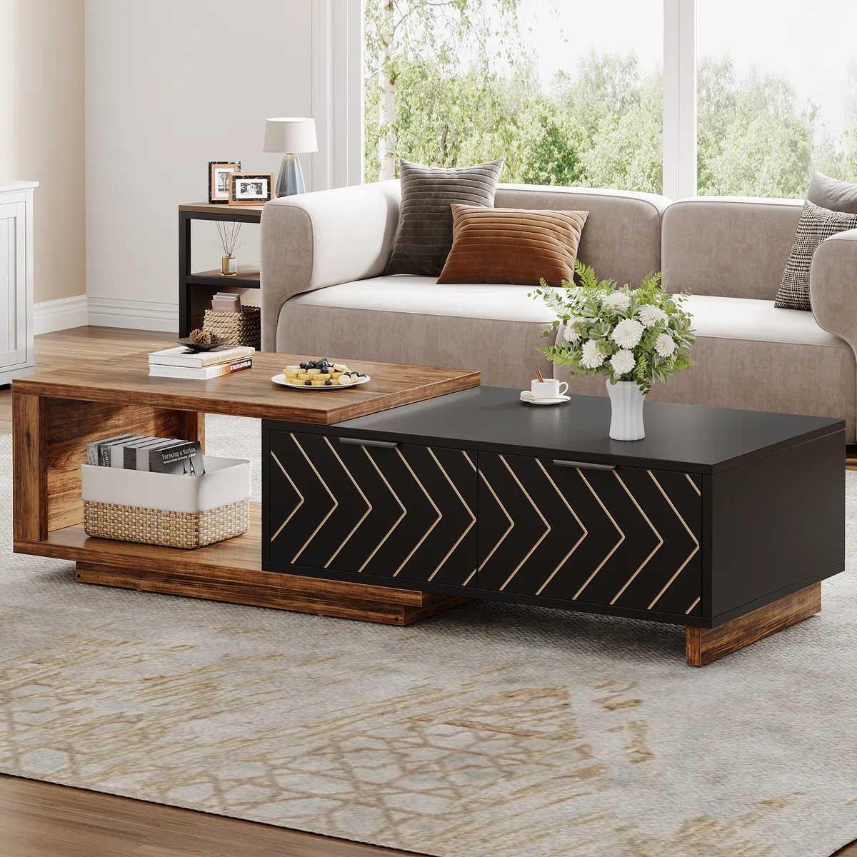 Rectangular dual‑tone walnut and oak coffee table with expandable design, two drawers featuring V‑shaped wood grain, brass pulls, and hidden open shelf.