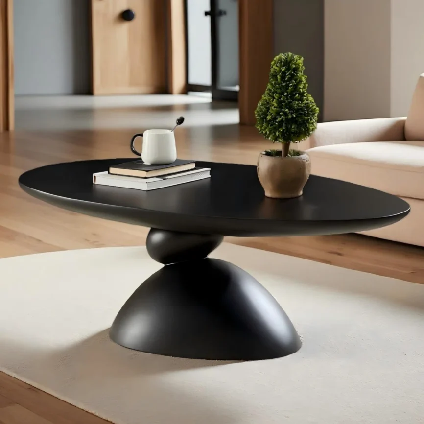 The Zenith Stone Oval Coffee Table is a sculptural centerpiece inspired by Tibetan stone-stacking rituals, symbolizing harmony and good fortune