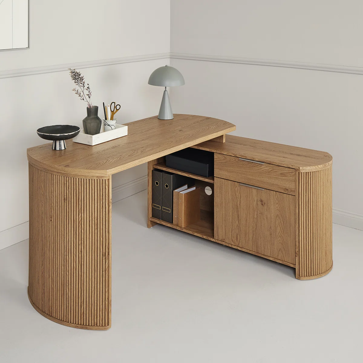 Brown L-shaped desk with curved side panels, 3D wood grain finish, drawer, cabinet, and open shelf.
