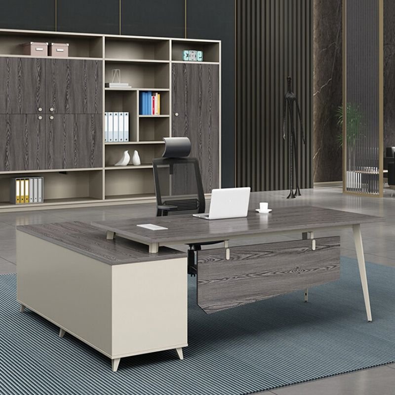 Modern L-shaped executive boardroom desk with integrated cable management, CPU storage, drawers, and desk return.