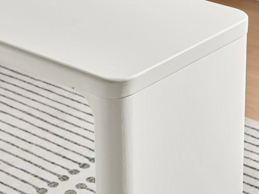 Minimalist cream-colored home office desk with sculptural lines, MDF frame, and spacious tabletop.
