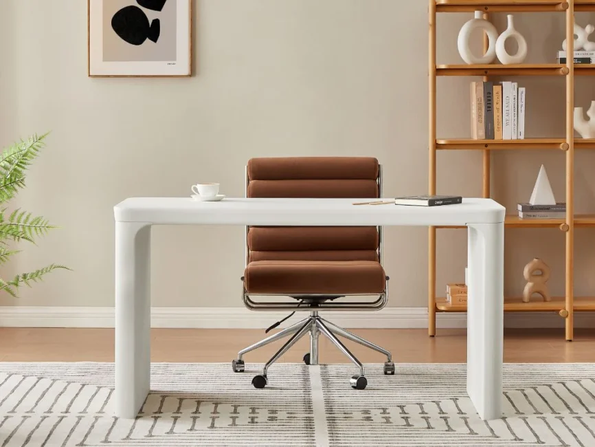 Minimalist cream-colored home office desk with sculptural lines, MDF frame, and spacious tabletop.